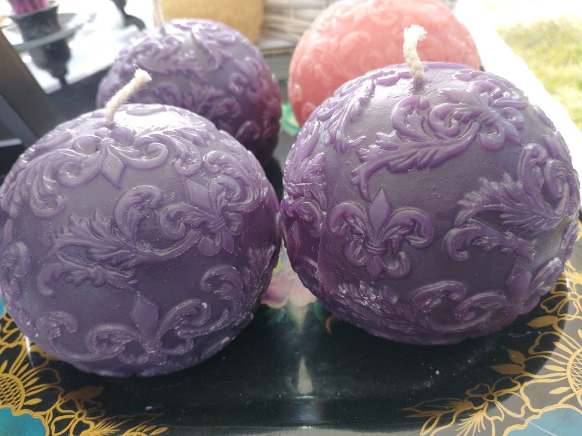 Beeswax ball candle with fleur-de-lis pattern
